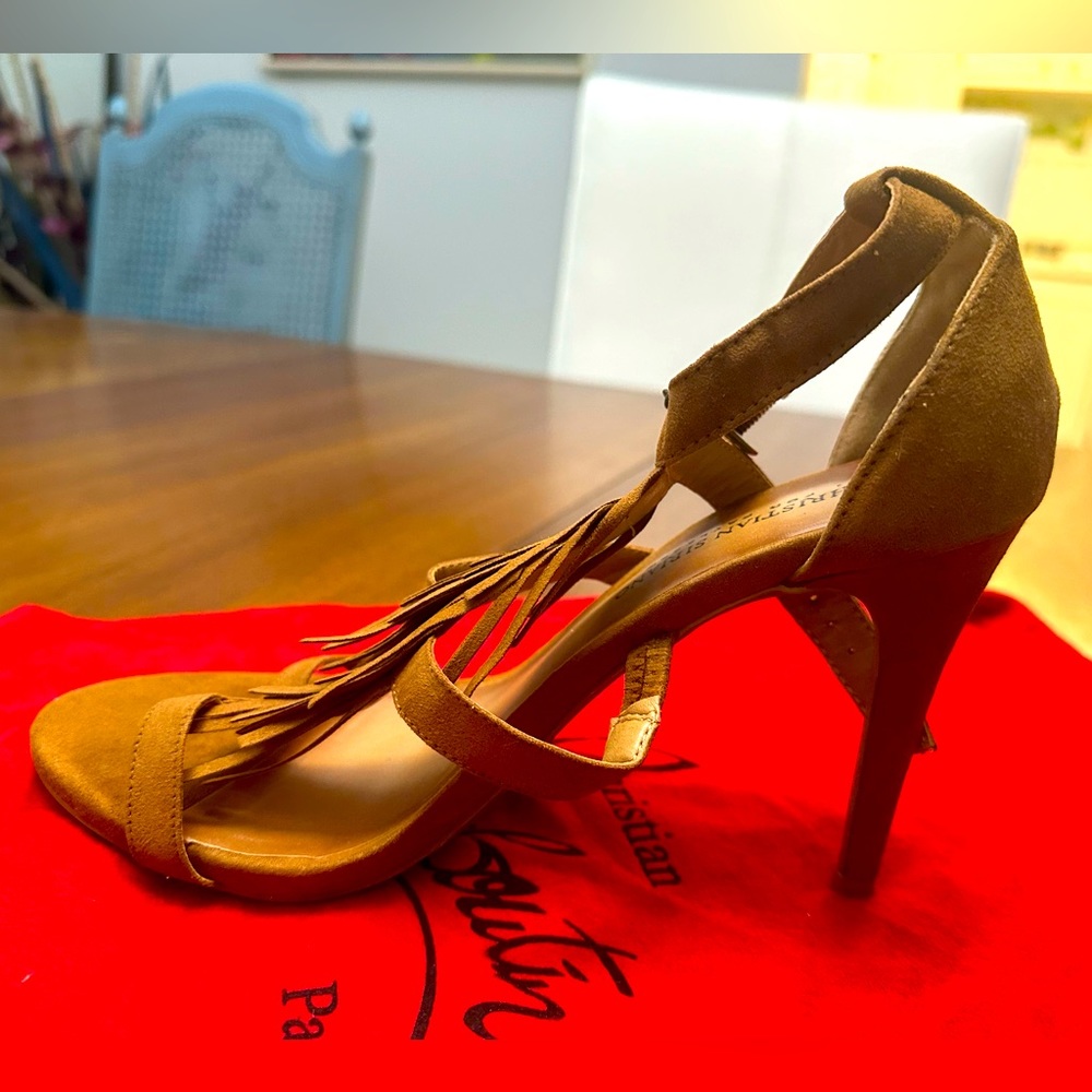 Rarely worn, almost Brand New, heels tan with tassels